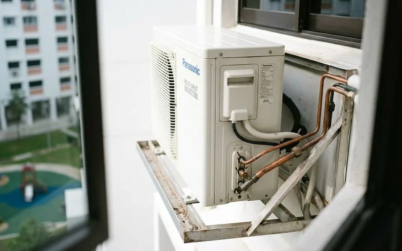 Panasonic multi-split outdoor unit on HDB ledge